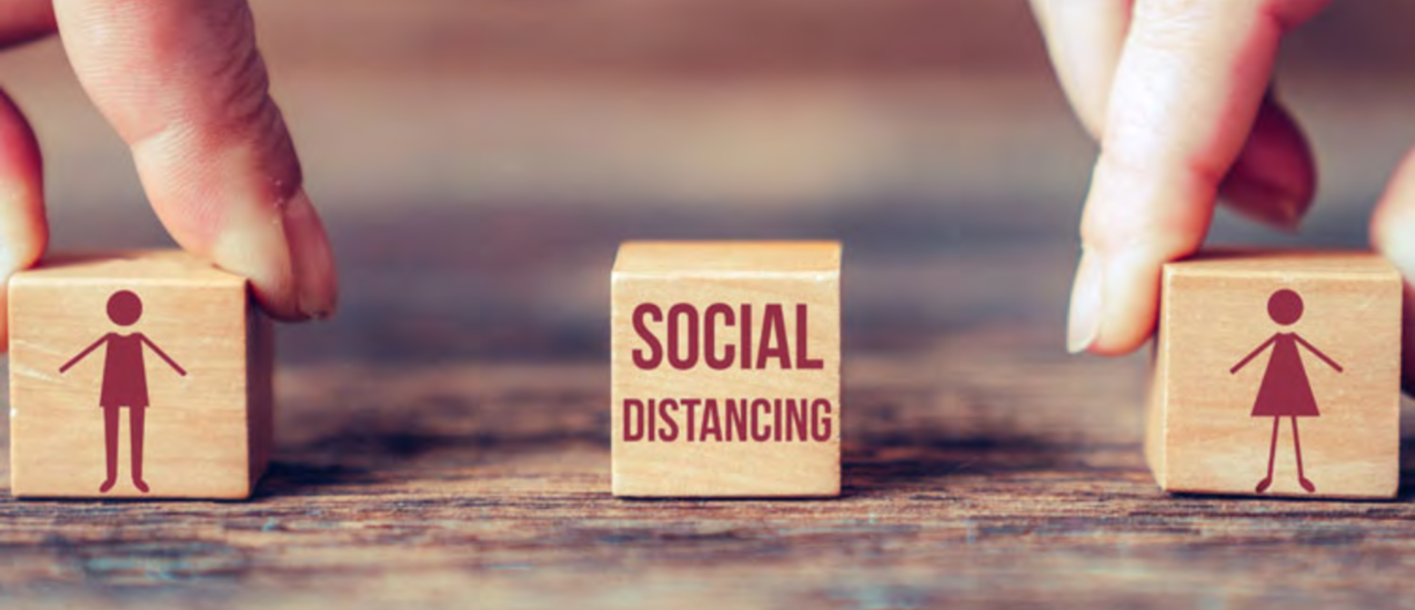 Social distancing depicted by wooden blocks